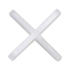 Close-up of a white cross tile spacer