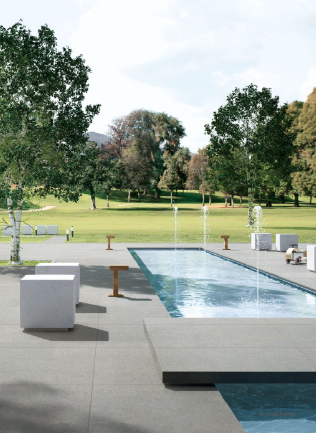 Particle Grey porcelain tile around a pool